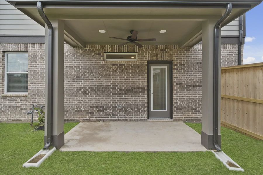 Exterior details and patio area of a home in Elyson Courtyard Collection, Katy (Image 4).