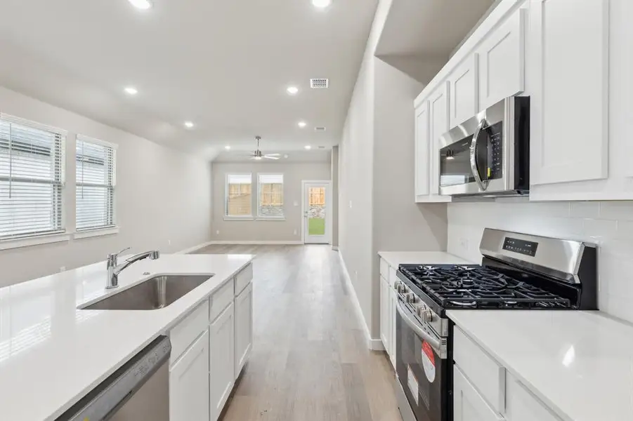 Kitchen in the Elm home plan by Trophy Signature Homes – REPRESENTATIVE PHOTO Kitchen in the Elm home plan by Trophy Signature Homes – REPRESENTATIVE PHOTO