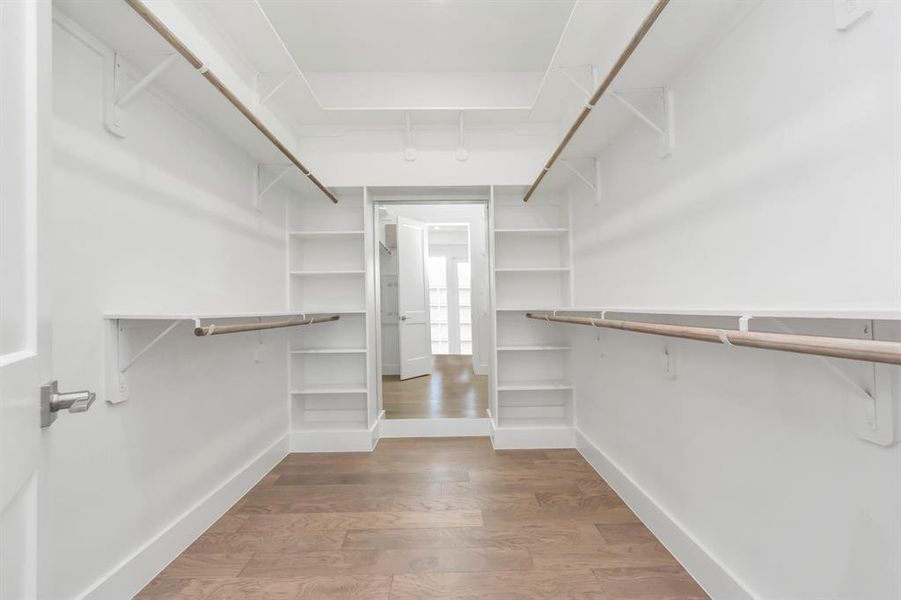 Primary Huge walk-in closet with sensor light and full body mirror.