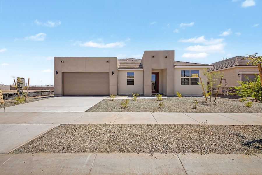 Front exterior of a new home in Miravida, Surprise, AZ, highlighting curb appeal (Image 1). Front exterior of a new home in Miravida, Surprise, AZ, highlighting curb appeal (Image 1).