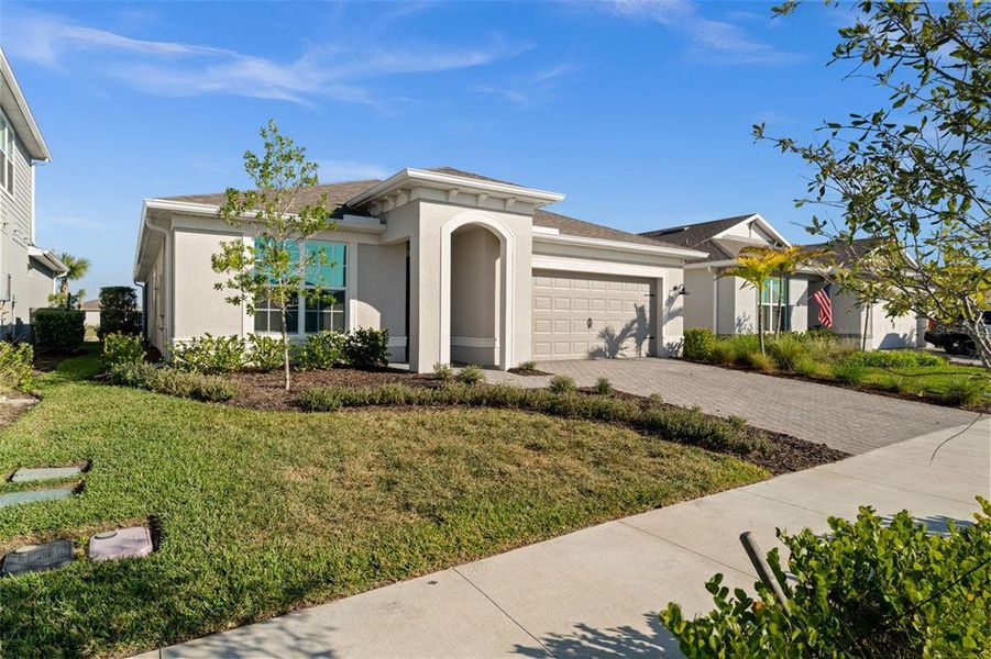 Front exterior of a new home in , Punta Gorda, FL, highlighting curb appeal (Image 2).
