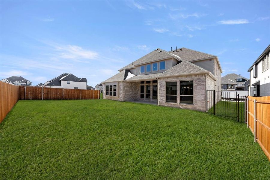 Exterior details and patio area of a home in Collinsbrook Farm, Frisco (Image 25).