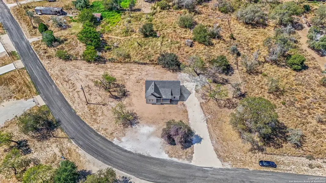 Front exterior of a new home in , Lytle, TX, highlighting curb appeal (Image 2). Front exterior of a new home in , Lytle, TX, highlighting curb appeal (Image 2).