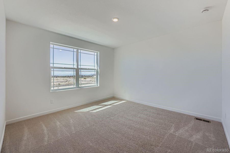 Spacious, unfurnished interior of a new home in Percheron: The Explorer Collection, Colorado Springs (Image 8).