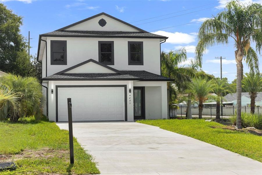 Front exterior of a new home in , Tampa, FL, highlighting curb appeal (Image 19).
