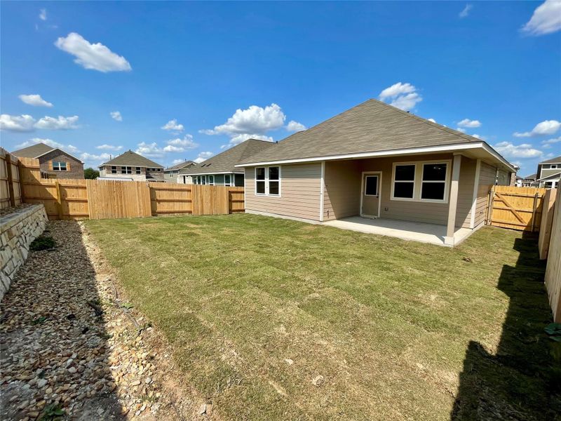 Front exterior of a new home in Covered Bridge, Hutto, TX, highlighting curb appeal (Image 14). Front exterior of a new home in Covered Bridge, Hutto, TX, highlighting curb appeal (Image 14).