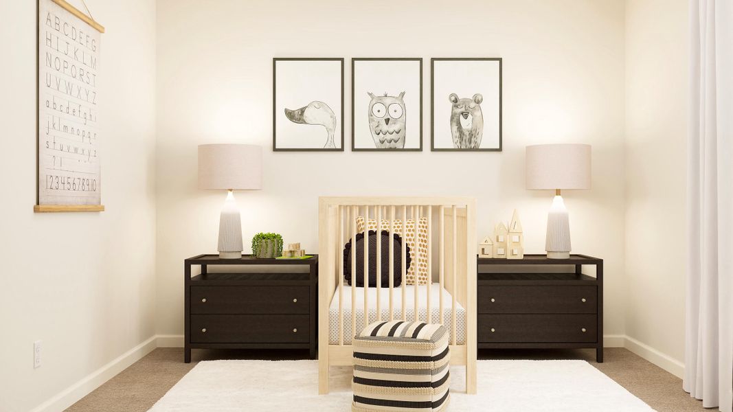 A room with a crib and a dresser with pictures on the wall.