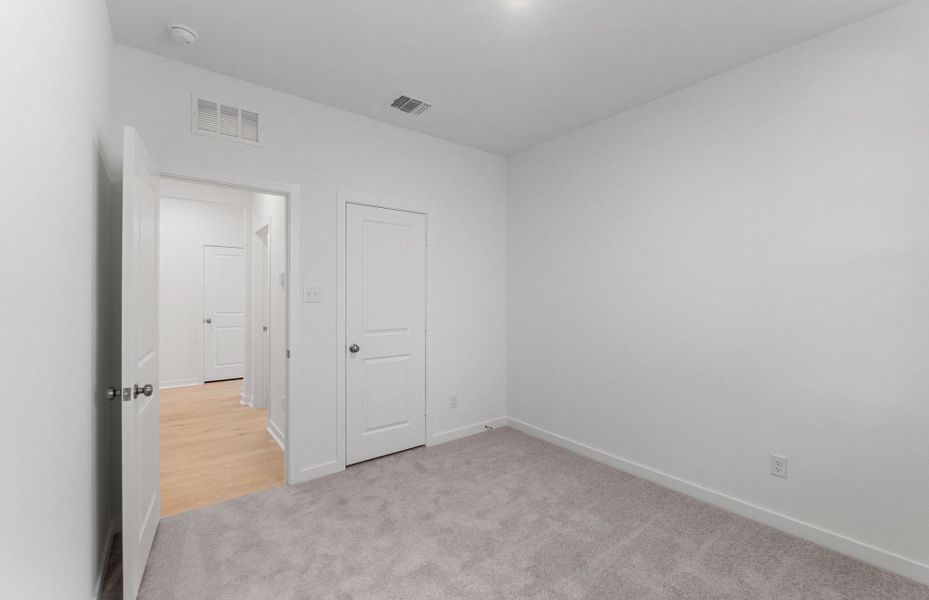 Spacious, unfurnished interior of a new home in Sunfield, Buda (Image 11). Spacious, unfurnished interior of a new home in Sunfield, Buda (Image 11).