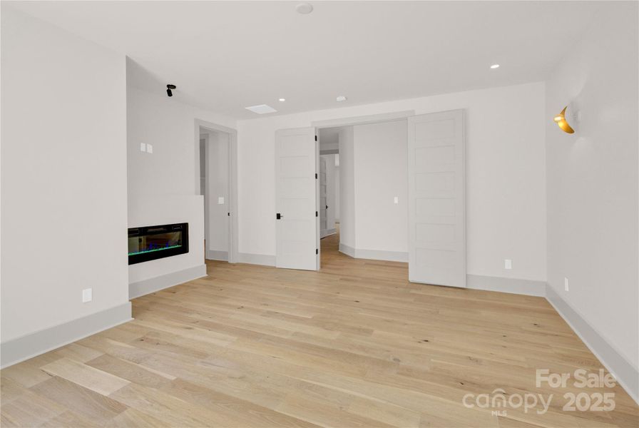 Upper level primary suite has electric fireplace Upper level primary suite has electric fireplace