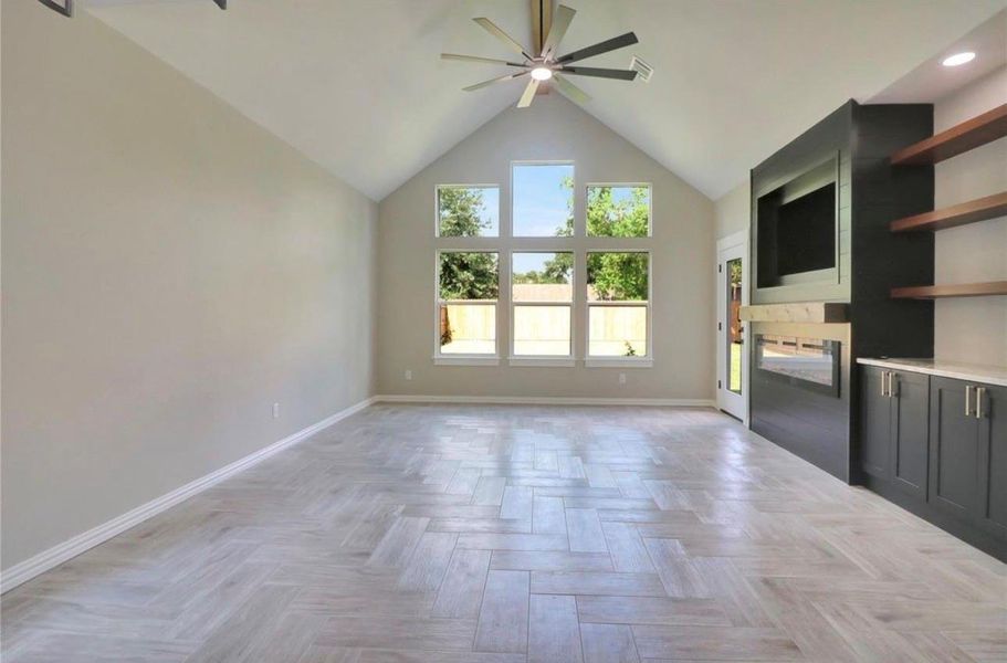 Elegant built-in cabinets complement the exquisite herringbone tile flooring.
