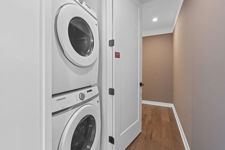 Representative Photo. Laundy closet with stacked washer and dryer included in unit.
