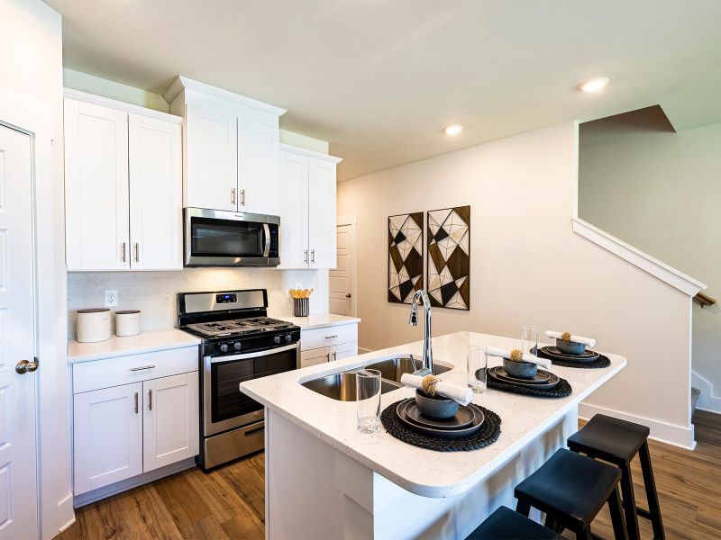 Enjoy your morning tea at the stunning kitchen island. Photography from City Station Townes. Enjoy your morning tea at the stunning kitchen island. Photography from City Station Townes.