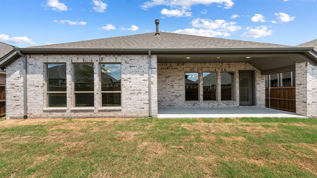 Front exterior of a new home in Trinity Falls 50', McKinney, TX, highlighting curb appeal (Image 2). Front exterior of a new home in Trinity Falls 50', McKinney, TX, highlighting curb appeal (Image 2).