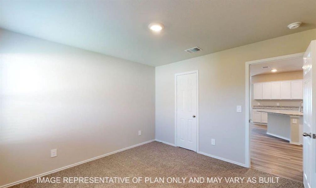 Neutral painted walls featuring a recessed ceiling light, carpeted flooring, and white trim Neutral painted walls featuring a recessed ceiling light, carpeted flooring, and white trim