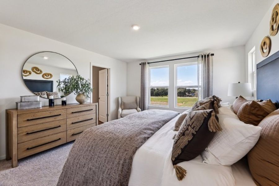 A bedroom with a bed and a dresser. A bedroom with a bed and a dresser.