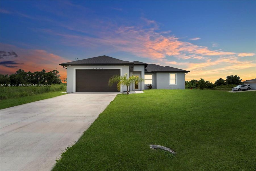 Front exterior of a new home in , Lehigh Acres, FL, highlighting curb appeal (Image 17).