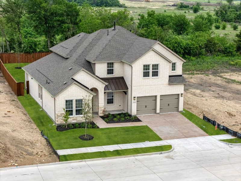 Front exterior of a new home in Milrany Ranch, Melissa, TX, highlighting curb appeal (Image 29).