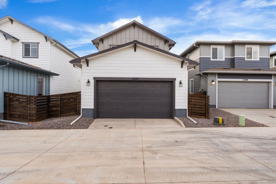 Front exterior of a new home in Barefoot Village, Longmont, CO, highlighting curb appeal (Image 1). Front exterior of a new home in Barefoot Village, Longmont, CO, highlighting curb appeal (Image 1).