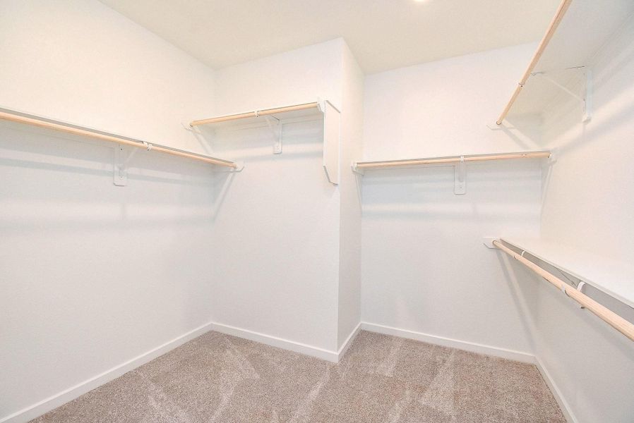 LARGE WALK IN CLOSET IN THE PRIMARY BATHROOM
