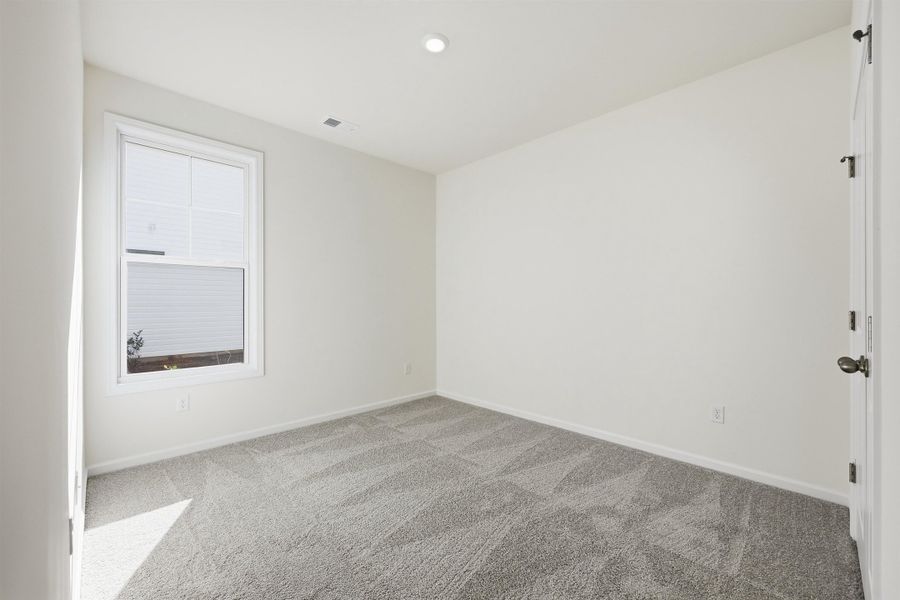 Unfurnished room featuring carpet flooring and baseboards