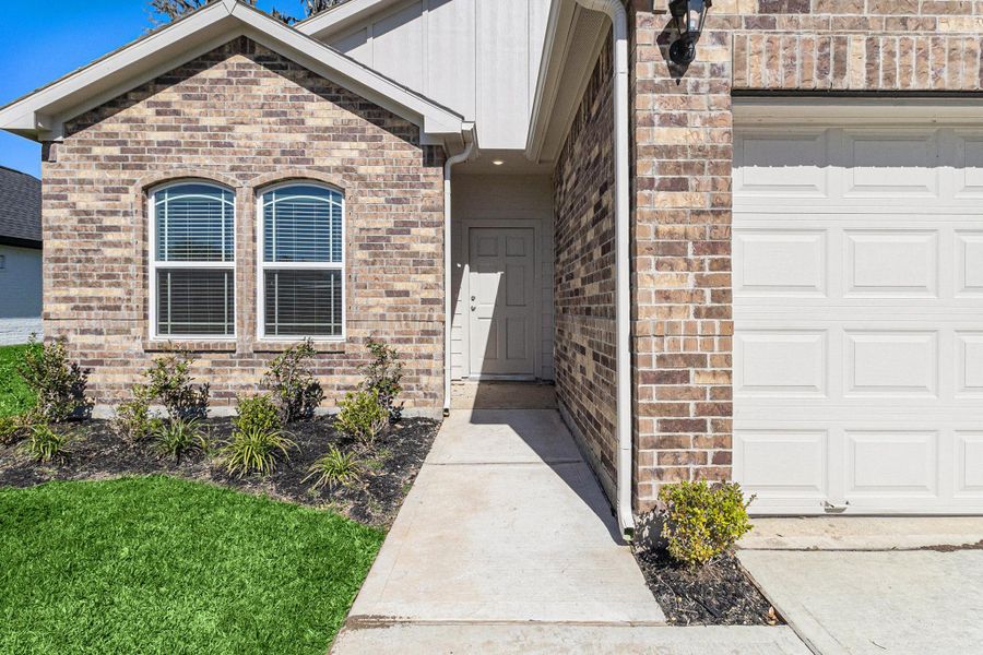 Front exterior of a new home in Columbia Lakes, West Columbia, TX, highlighting curb appeal (Image 17). Front exterior of a new home in Columbia Lakes, West Columbia, TX, highlighting curb appeal (Image 17).