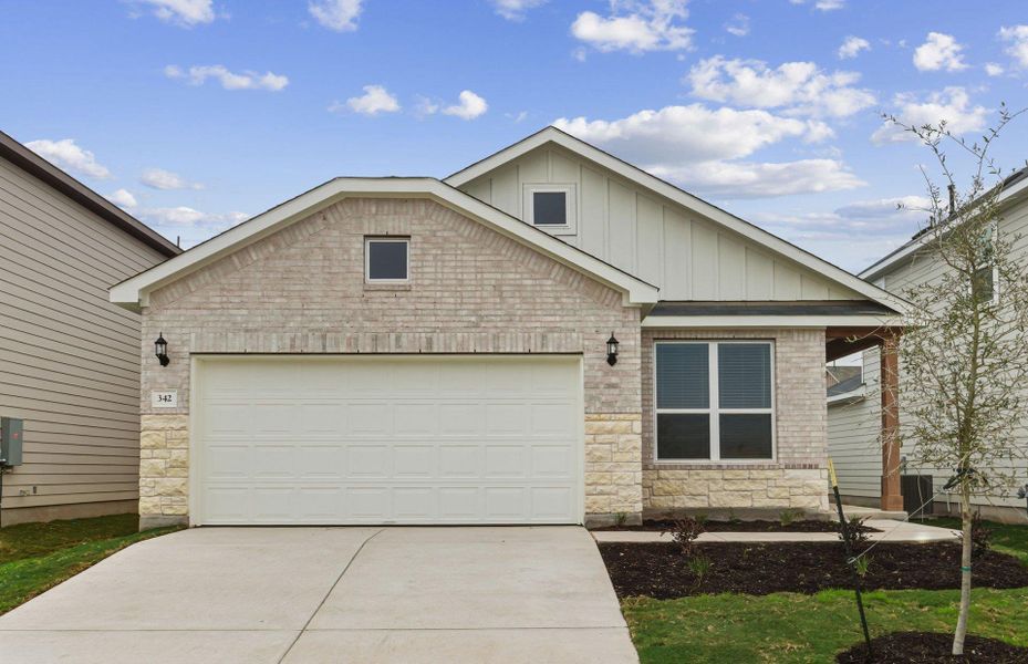 Front exterior of a new home in Sunfield, Buda, TX, highlighting curb appeal (Image 18).