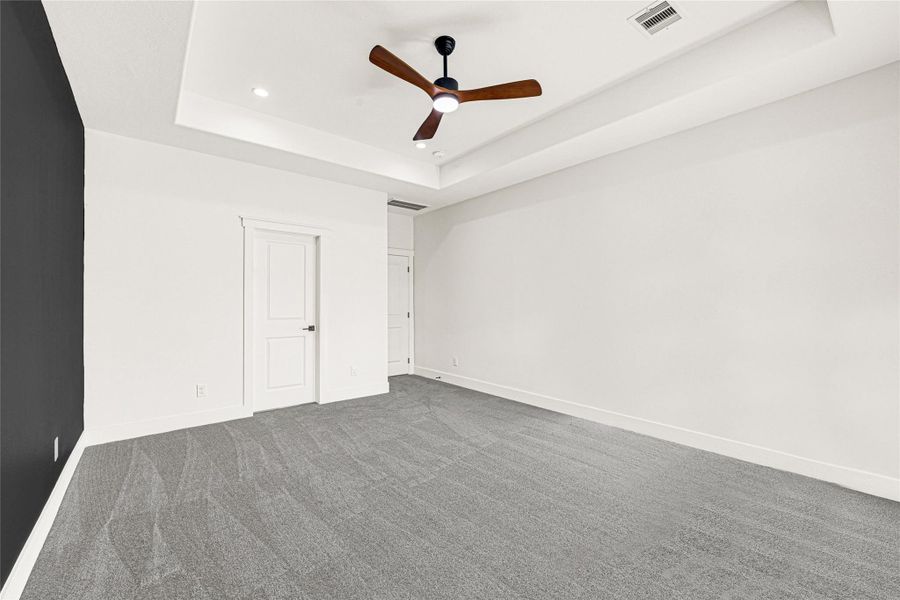 Primary bedroom features a tray ceiling Primary bedroom features a tray ceiling