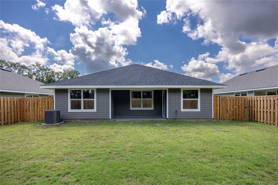 Front exterior of a new home in Savannah Station, Alachua, FL, highlighting curb appeal (Image 8).
