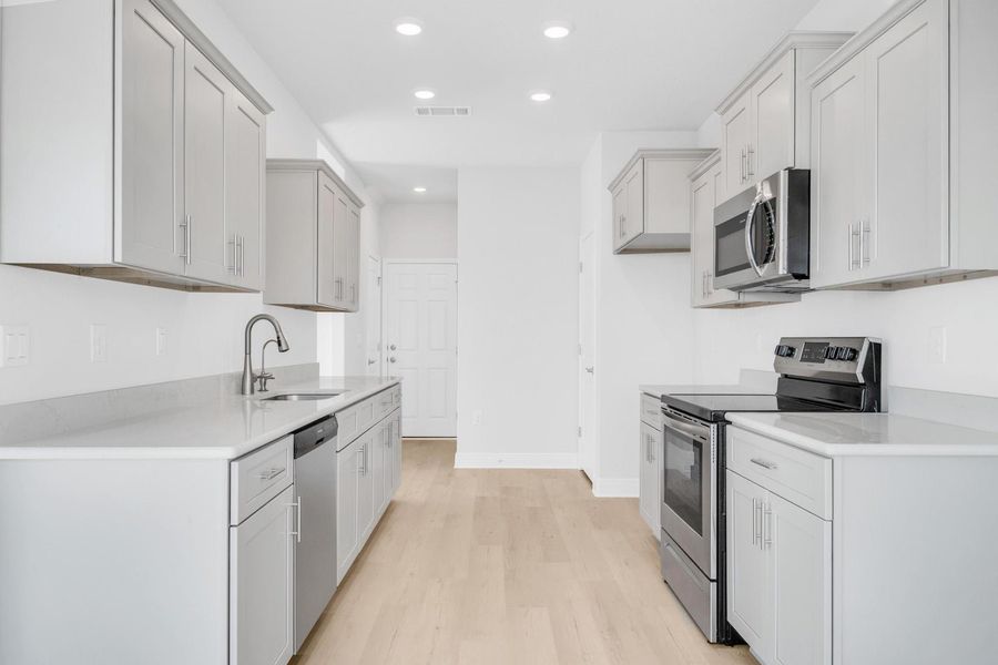 Representative furnished interior of a home built from the Plan 1817 by Adams Homes in Pine Top, Cantonment (Image 5).