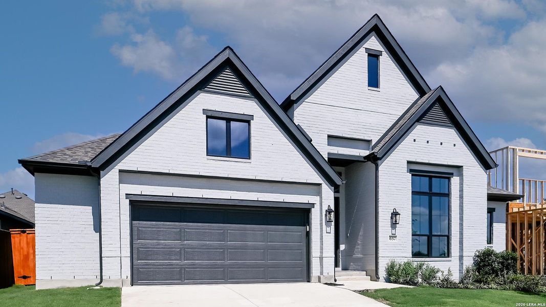 Front exterior of a new home in Veramendi, New Braunfels, TX, highlighting curb appeal (Image 23). Front exterior of a new home in Veramendi, New Braunfels, TX, highlighting curb appeal (Image 23).