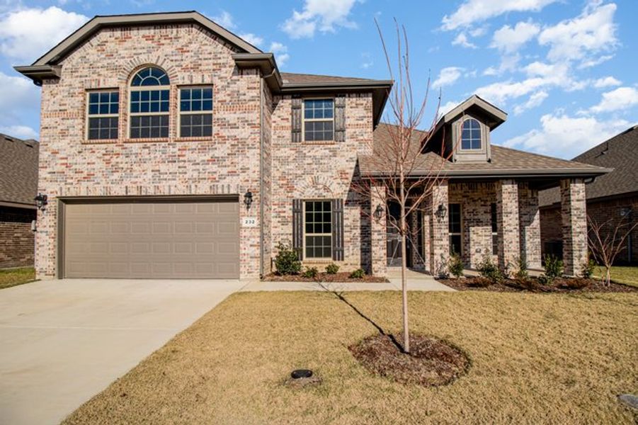 Front exterior of a new home in Mustang Place II, Heartland, TX, highlighting curb appeal (Image 18).