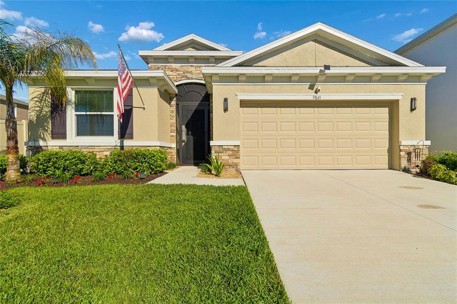 Front exterior of a new home in , Wesley Chapel, FL, highlighting curb appeal (Image 22).