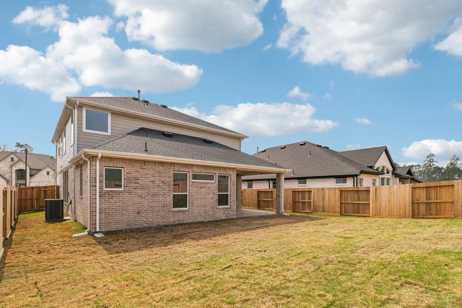 Exterior details and patio area of a home in The Highlands, Porter (Image 22).