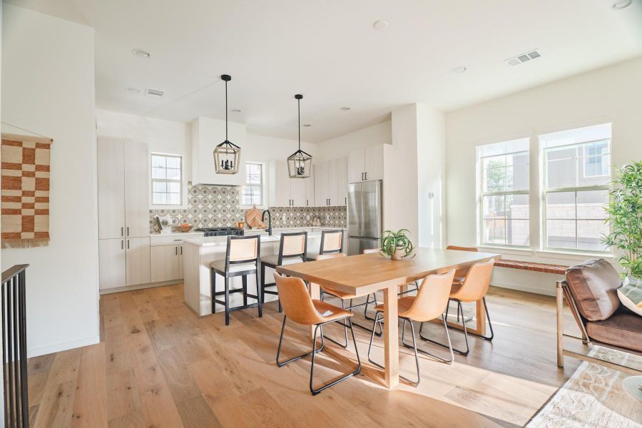 Dining area featuring light wood-type flooring and recessed lighting