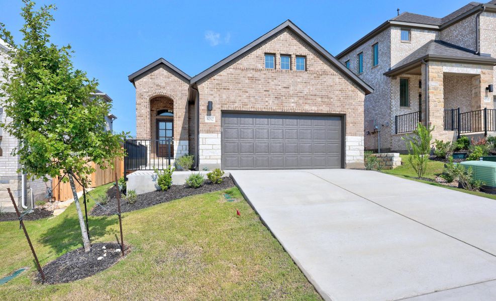Front exterior of a new home in Lakeside at Tessera, Lago Vista, TX, highlighting curb appeal (Image 20).