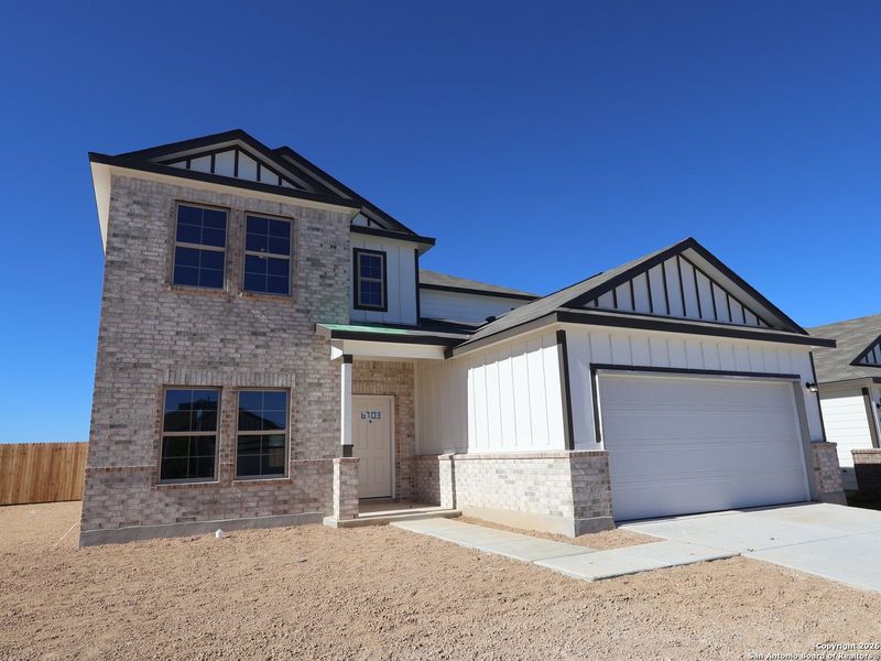 Front exterior of a new home in Winding Brook, San Antonio, TX, highlighting curb appeal (Image 19).