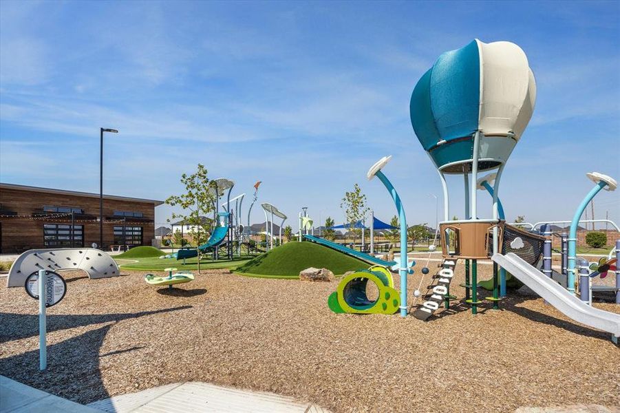 Playground with two covered picnic areas on either side. Perfect for play dates!