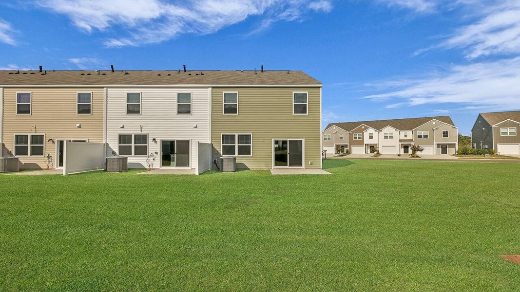 Exterior details and patio area of a home in Carolina Groves Townhomes, Moncks Corner (Image 4).
