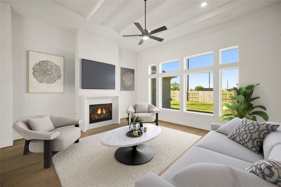 The open family room boasts high ceilings and plenty of windows to fill the home with light. The open family room boasts high ceilings and plenty of windows to fill the home with light.