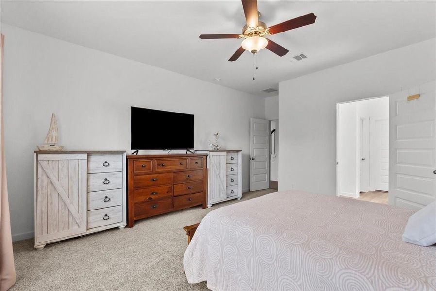 Primary bedroom located on the first floor offers a private en-suite bath