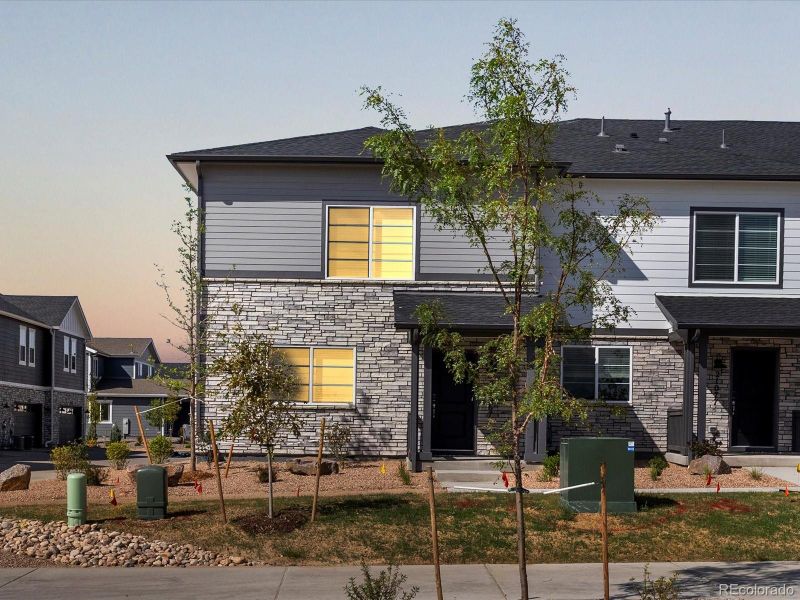 Front exterior of a new home in Skyview at High Point, Aurora, CO, highlighting curb appeal (Image 21).