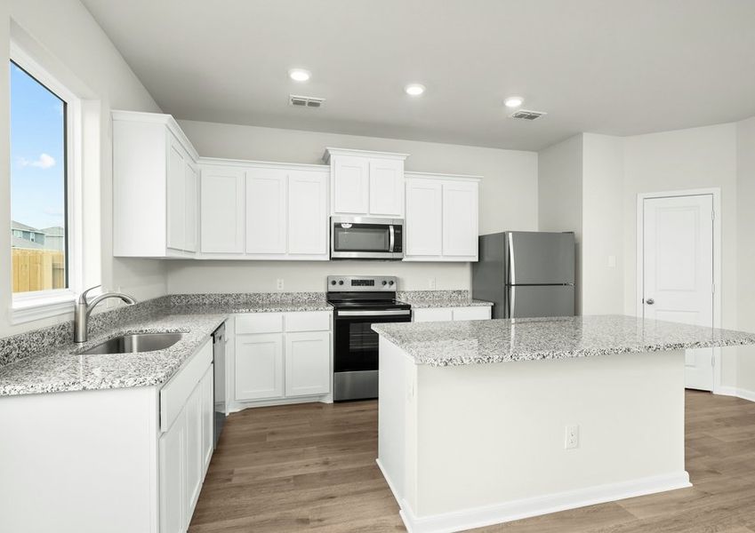 The kitchen has sprawling granite countertops. The kitchen has sprawling granite countertops.