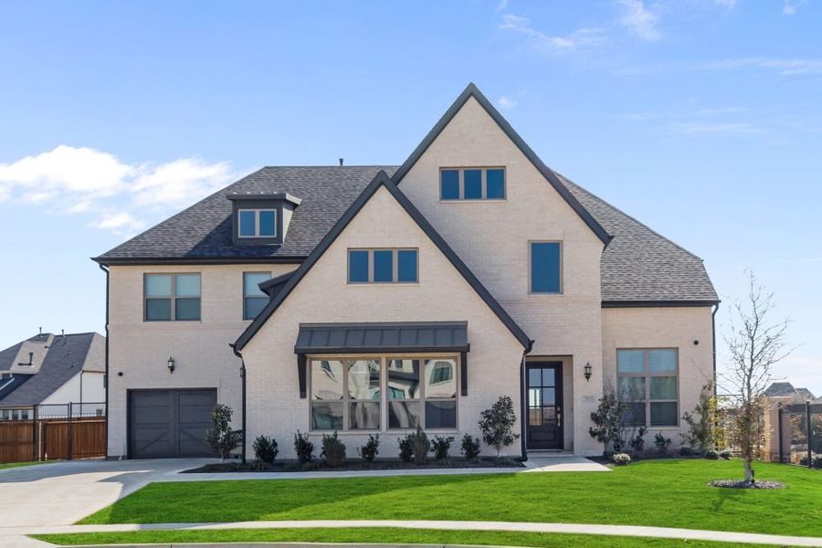 Representative exterior photo of a completed home built from the Plan 6032 by Tradition Homes in StarView – 74′, Prosper, TX (Image 1). Representative exterior photo of a completed home built from the Plan 6032 by Tradition Homes in StarView – 74′, Prosper, TX (Image 1).