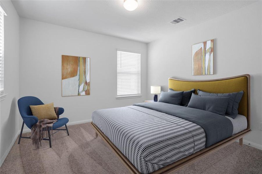 Secondary bedroom features plush carpet, custom paint, lighting, ample closet space, and a large window with privacy blinds.