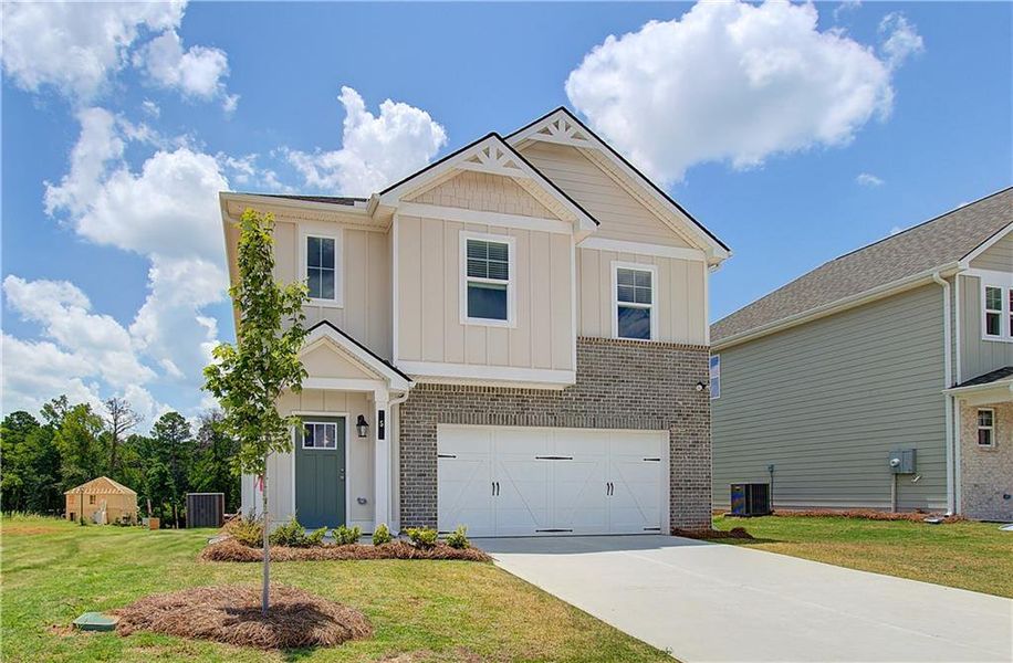 Front exterior of a new home in Enclave at Evergreen, Fairburn, GA, highlighting curb appeal (Image 20).