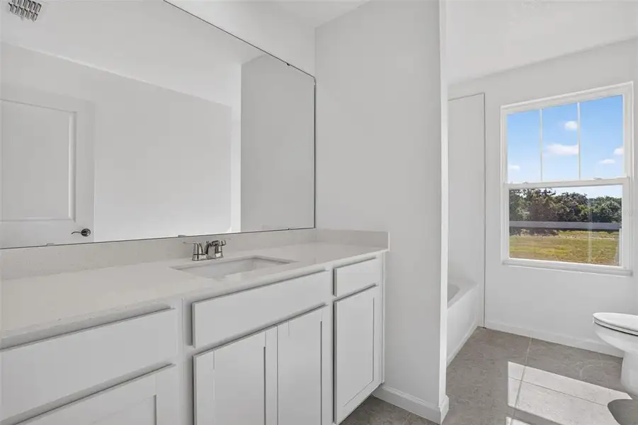 Furnished interior view inside a new home in Sanderling, Palmetto (Image 9).
