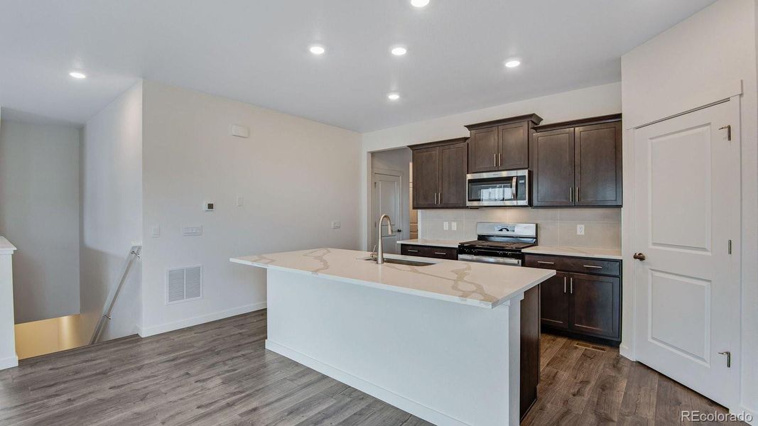 Furnished interior view inside a new home in Trails at Crowfoot, Parker (Image 12).