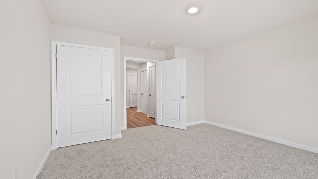 Spacious, unfurnished interior of a new home in Bentley Park, Greenwood (Image 18).