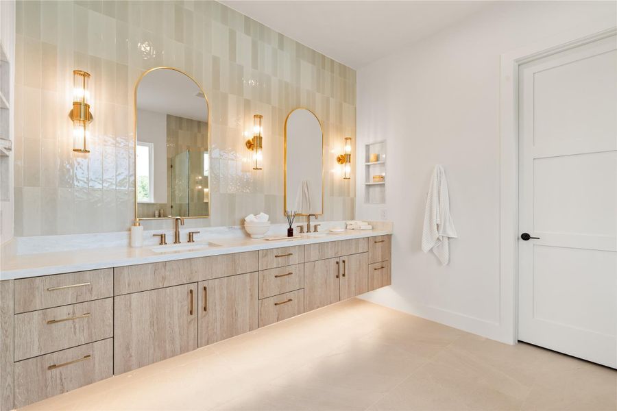 The floating vanity and layered lighting give this space a soft, grounded elegance — the kind of bathroom that makes you want to slow your morning down instead of rushing through it. Every detail here was clearly considered.