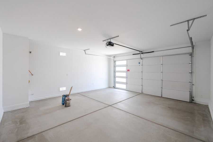 A room with white walls and a light on the ceiling.